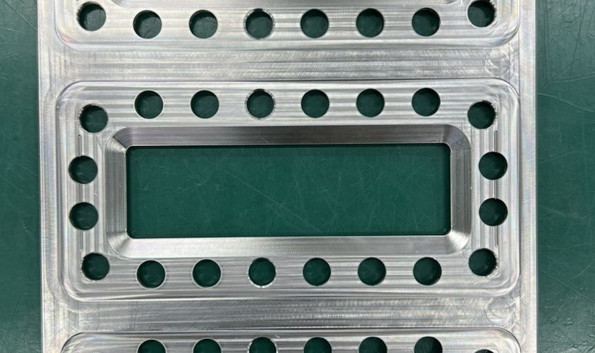 High-density precision-drilled plate with 1000+ holes